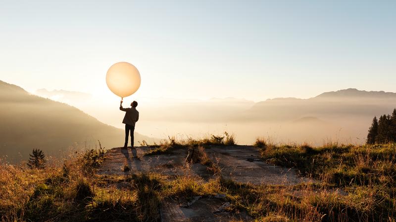 Man sending a radiosonde from a hill