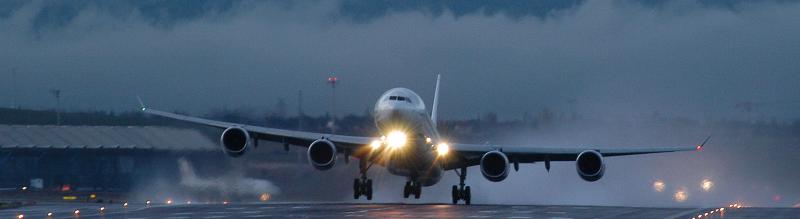 Airplane landing in rain